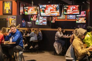 Tables are kept 6 feet apart at Buffalo Wild Wings during the Super Bowl on Sunday, Feb. 7, 2021. Social distancing is still maintained after Governor Kim Reynolds removed the mandate at 12:01 a.m. that morning.  (Jeff Sigmund/Daily Iowan)