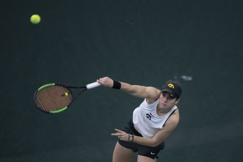 Iowa’s Elise Van Heuvelen Treadwell hits the ball during the Iowa women’s tennis meet v. Northwestern in the Hawkeye Tennis and Recreation Complex on Sunday, Feb. 14, 2021. Northwestern defeated Iowa with a score of 6-1.