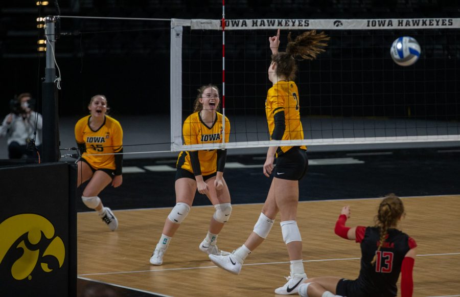 Iowa Setter Bailey Ortega celebrates a point following a kill from Outside Hitter Courtney Buzzerio during a womens volleyball match between Iowa and Rutgers at Xtream Arena on Saturday, Feb. 20, 2021. The Scarlet Knights defeated the Hawkeyes 3 sets to 2.