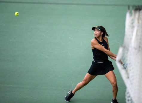 Iowa’s Michelle Bacalla watches the ball come to her during a womens tennis meet at the Hawkeye Tennis and Recreation Complex on Thursday, Feb. 26, 2021. The Hawkeyes defeated the Hoosiers with a score of 4-3.