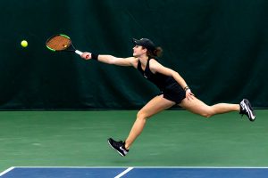 Iowa’s Elise van Heuvelen Treadwell runs to hit the ball over the net during the Iowa Women’s Tennis match against Purdue on Feb. 28, 2021 at the Hawkeye Tennis and Recreation Complex. Iowa defeated Purdue 6-1.