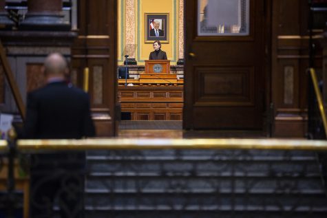 Gov. Kim Reynolds prepares for the State of the State Address within the house chambers of the Iowa State Capitol Building on Tuesday, Jan. 12, 2021 in Des Moines. Tuesday marks the second day of the 2021 Iowa legislative session, in which Gov. Reynolds will give her address in the evening. 