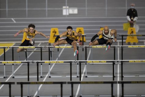 Iowa hurdlers Gratt Reed, Jamal Britt, Iowa alum Aaron Mallett––who ran unattached––compete in the 60m hurdle premier final during the second day of the Larry Wieczorek Invitational on Saturday, Jan. 23, 2021 at the University of Iowa Recreation Building. Reed, Britt, and Mallett finished fifth, second, and first, respectively. Due to coronavirus restrictions, the Hawkeyes could only host Big Ten teams. Iowa men took first, scoring 189, and women finished third with 104 among Minnesota, Wisconsin, Nebraska, and Illinois. 