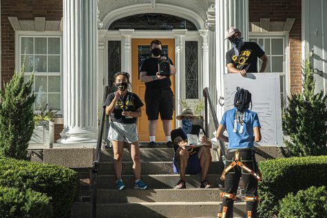 University of Iowa senior Jade Miller speaks at a demonstration held in front of University President Bruce Harrelds home on Wednesday, Aug. 19, 2020. The Campaign to Organize Graduate Students (COGS) led a march to Harrelds home in order to protest the administrations insistence that the university remain open despite the health risk posed by COVID-19. 