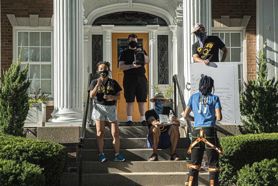 University+of+Iowa+senior+Jade+Miller+speaks+at+a+demonstration+held+in+front+of+University+President+Bruce+Harrelds+home+on+Wednesday%2C+Aug.+19%2C+2020.+The+Campaign+to+Organize+Graduate+Students+%28COGS%29+led+a+march+to+Harrelds+home+in+order+to+protest+the+administrations+insistence+that+the+university+remain+open+despite+the+health+risk+posed+by+COVID-19.+