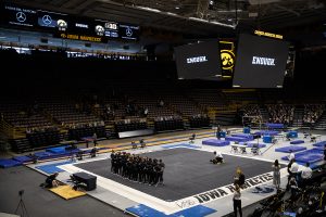 The Iowa women’s gymnastics team watches a video together after a women’s gymnastics meet between the Iowa Gym-Hawks and the Minnesota Golden Gophers at Carver-Hawkeye Arena on Saturday, Feb. 6, 2021. The video was dedicated to fighting racial injustice and creating unity. The Hawks defeated the Gophers, 196.800-196.375. 