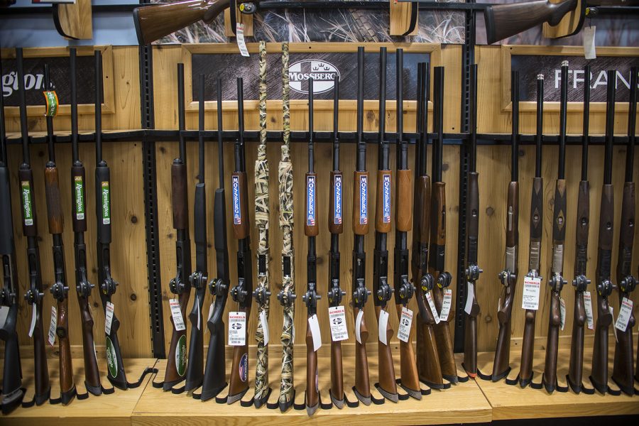 Guns are displayed at Scheels in Coralville on Tuesday, April 11, 2017. The Iowa House recently accepted the stand-your-ground-provision, an amendment to HF 517, which permits an individual to use deadly force when their life is in danger. 