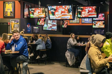Tables are kept 6 feet apart at Buffalo Wild Wings during the Super Bowl on Sunday, Feb. 7, 2021. Social distancing is still maintained after Governor Kim Reynolds removed the mandate at 12:01 a.m. that morning. 