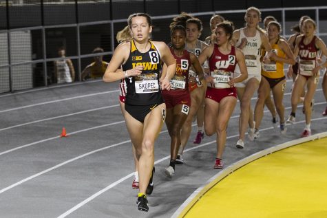 Iowa distance runner Gabby Skopec rounds the corner at the front of the pack in the women’s 3000m run during the fourth annual Larry Wieczorek Invitational at the University of Iowa Recreation Building on Friday, Jan 17, 2020. 