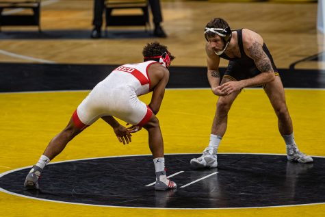 Iowa’s 141-pound Jaydin Eierman grapples with Nebraska’s Chad Red, Jr. during a wrestling dual meet between No. 1 Iowa and No. 6 Nebraska at Carver Hawkeye Arena on Friday, Jan. 15, 2021. No. 1 Eierman defeated No. 7 Red by decision, 8-4, and the Hawkeyes defeated the Cornhuskers, 31-6.