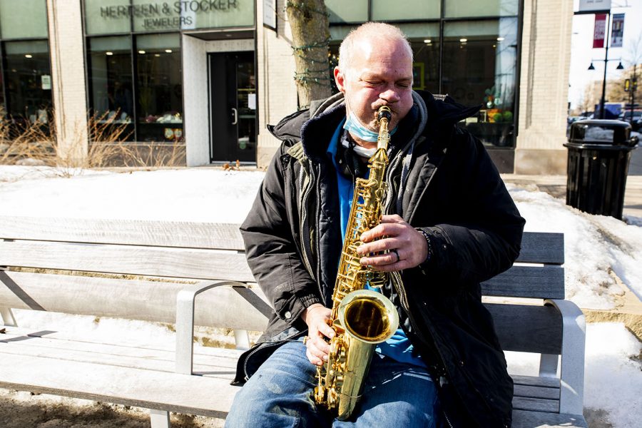 Eddie “The Sax Man” Raines, plays his saxophone on Thursday, Feb. 25, 2021 at the Ped Mall. Raines has been playing the saxophone for 44 years with the last six in Iowa City.