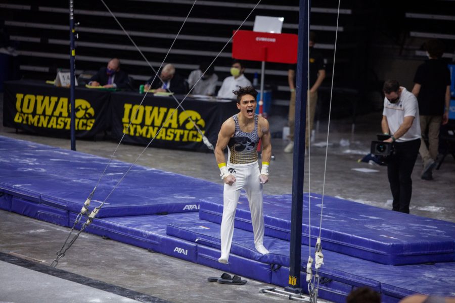 Iowa all around Evan Davis is energized after performing on the horizontal bar on Saturday, Feb. 20, 2022 during the Iowa vs. Penn State men’s gymnastics meet at Carver-Hawkeye Arena. Iowa defeated Penn State 398.850-393.550. Davis tied for first on the horizontal bar with Penn State’s Michael Jaroh and Matt Cormier with a final score of 13.250. 