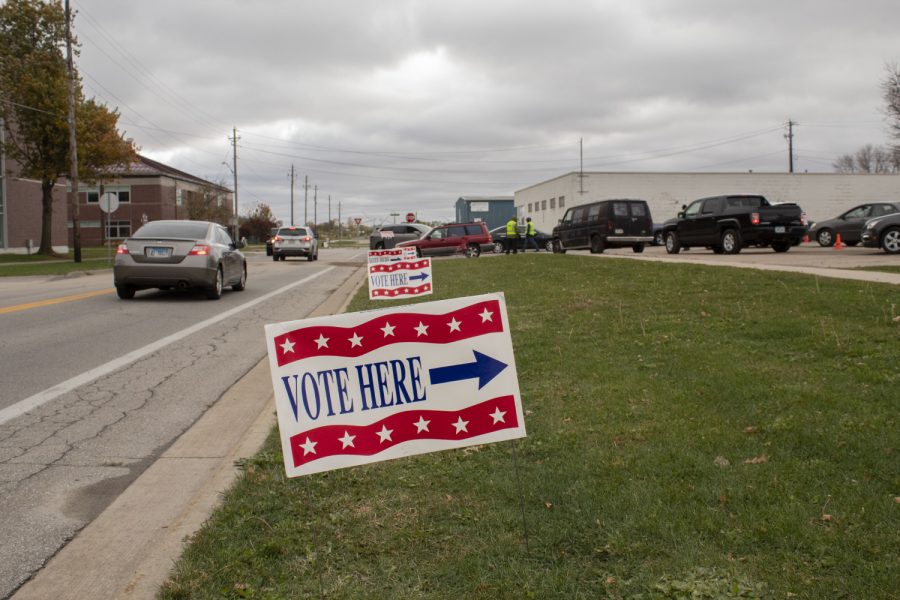 Johnson County holds Drive-Up early voting in the parking ramp of the Johnson County Health and Human Services Building on Oct. 23, 2020. Voters follow signs and wait in a line of cars to cast their ballot.