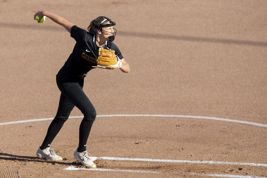 Pitcher Allison Doocy warms up during the Iowa softball fall opener against Des Moines Area Community College. The Hawkeyes beat the Bears 4-1 in 10 innings.