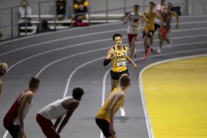 Jamal Britt finishes his leg of the 4x400m relay premier during the second day of the Larry Wieczorek Invitational on Saturday, Jan. 23, 2021 at the University of Iowa Recreation Building. Britt ran a split of 48.375, contributing to the Iowa ‘A’ team victory with a total time of 3:09.58. Due to coronavirus restrictions, the Hawkeyes could only host Big Ten teams. Iowa men took first, scoring 189, and women finished third with 104 among Minnesota, Wisconsin, Nebraska, and Illinois. (Jenna Galligan/The Daily Iowan)