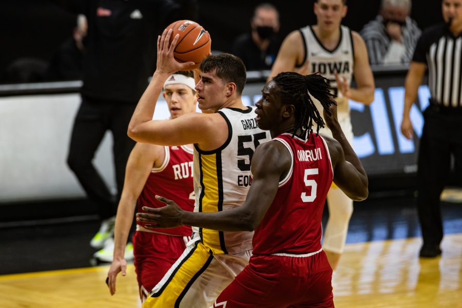 Iowa forward Luka Garza looks to pass during a mens basketball game between Iowa and Rutgers at Carver-Hawkeye Arena on Wednesday, Feb. 10, 2021. The Hawkeyes defeated the Scarlet Knights, 79-66.