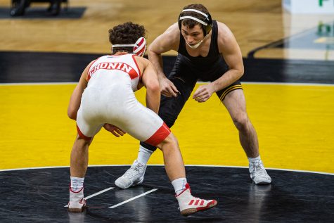 Iowa’s 125-pound Spencer Lee grapples with Nebraska’s Liam Cronin during a wrestling dual meet between No. 1 Iowa and No. 6 Nebraska at Carver Hawkeye Arena on Friday, Jan. 15, 2021. No. 1 Lee defeated No. 11 Cronin by tech fall in 1:21, and the Hawkeyes defeated the Cornhuskers, 31-6.