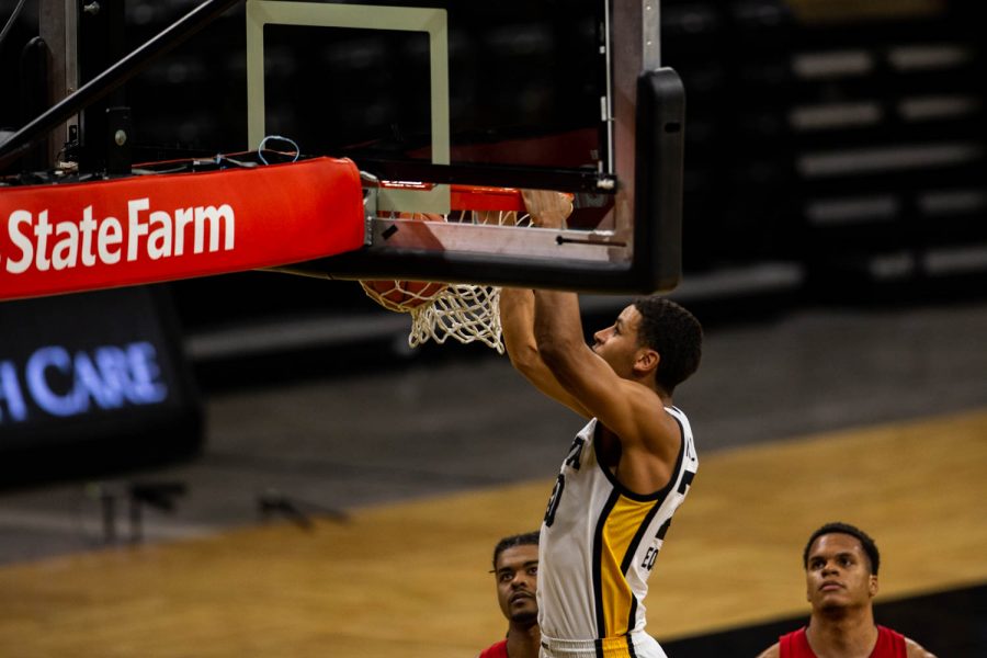 Iowa Forward Kris Murray (20) dunks the ball during an Iowa men’s basketball game against Nebraska on Thursday, March 4, 2021 at Carver-Hawkeye arena. The Hawks beat the Cornhuskers, 102-64.