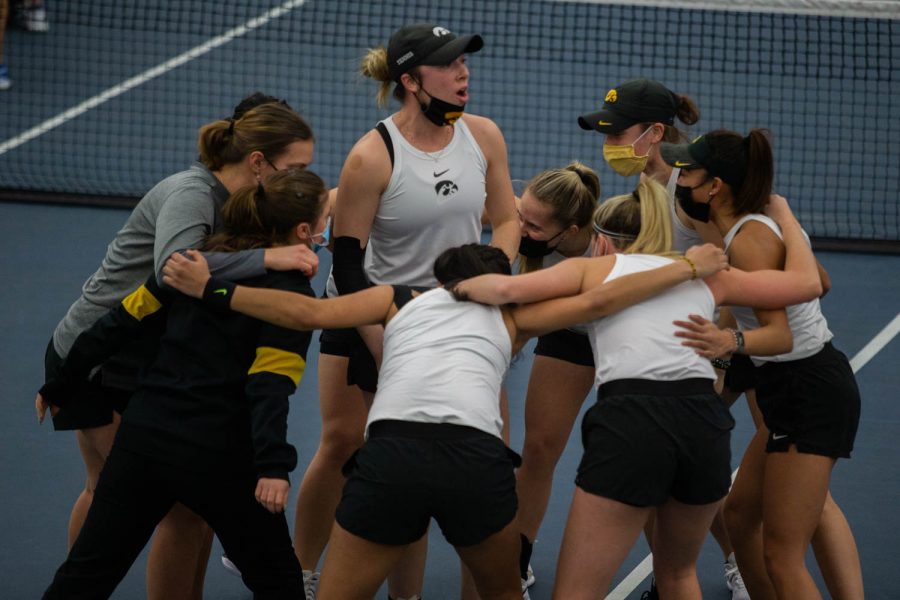 Iowas Samantha Mannix leads the team in a cheer before an Iowa womens tennis match against Penn State. The Hawkeyes topped Penn State 5-2, making it their fifth straight win of the season.