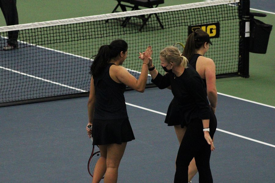 The+Iowa+womens+tennis+head+coach+Sasha+Schmid+high+fives+Vipasha+Mehra+at+the+Iowa+womens+tennis+meet+v.+Ohio+State+on+Sunday%2C+March+7%2C+2021.+The+Hawkeyes+were+defeated+by+the+Ohio+State+Buckeyes+2-5.