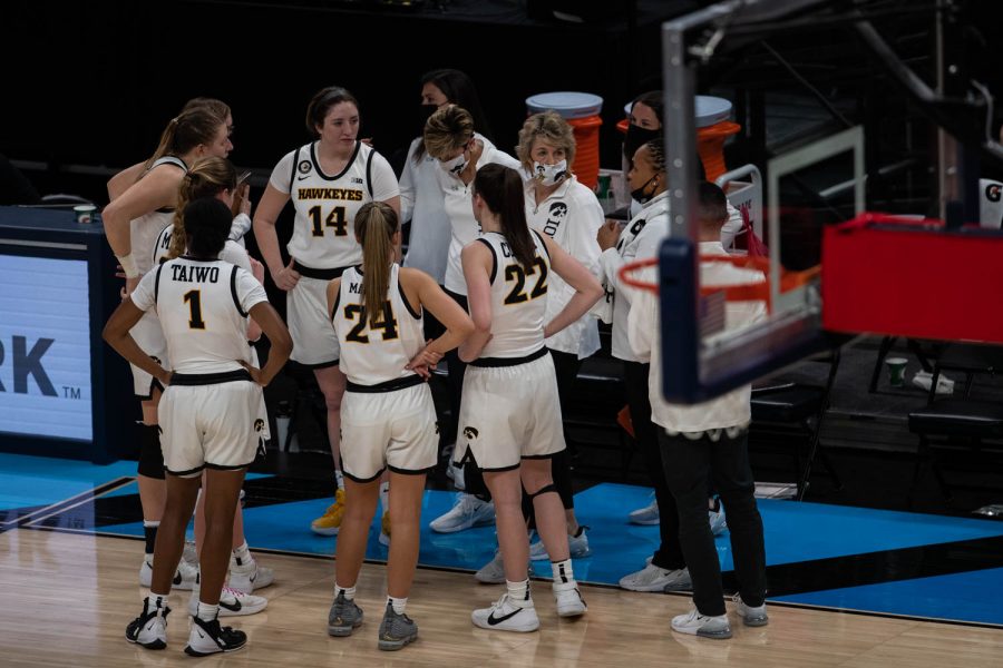 Iowa+Head+Coach+Lisa+Bluder+meets+with+her+team+at+a+time+out+during+a+second+round+game+of+the+Big+10+women%E2%80%99s+basketball+tournament.+Iowa%2C+ranked+%236%2C+took+on+%2311+Purdue+in+Indianapolis+at+the+Bankers+Life+Fieldhouse+Wednesday+night.+The+Hawkeyes+beat+the+Boilermakers%2C+83-72%2C+advancing+the+Hawks+to+take+on+Rutgers+Thursday+night+in+the+Big+10+quarterfinals.+
