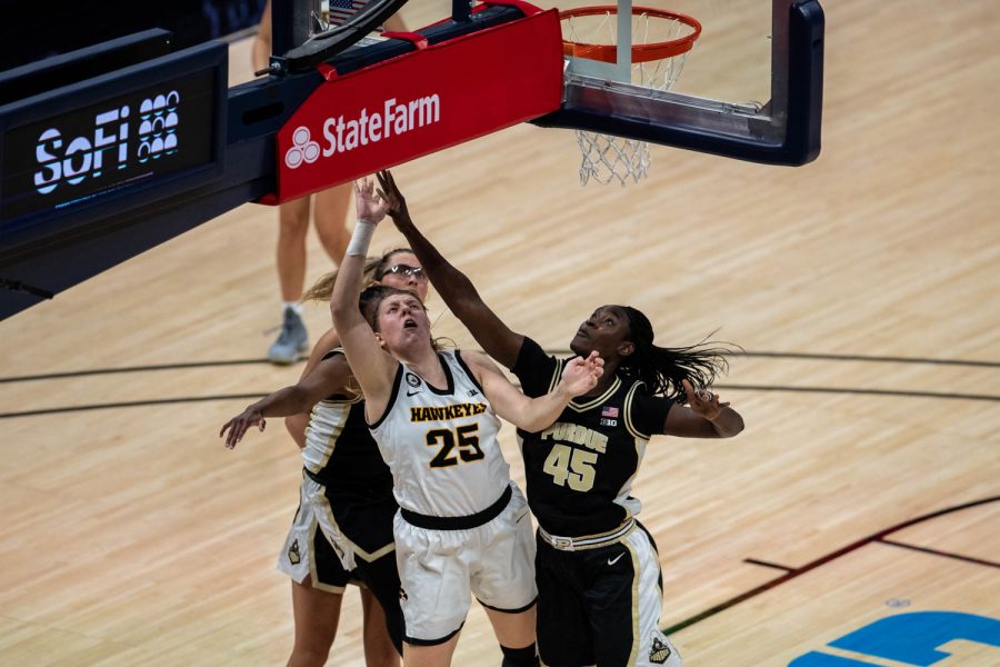 Iowa’s Monkia Czinano (25) is seen under the basket during a second round game of the Big 10 women’s basketball tournament. Iowa, ranked #6, took on #11 Purdue in Indianapolis at the Bankers Life Fieldhouse Wednesday night. The Hawkeyes beat the Boilermakers, 83-72, advancing the Hawks to take on Rutgers Thursday night in the Big 10 quarterfinals. 