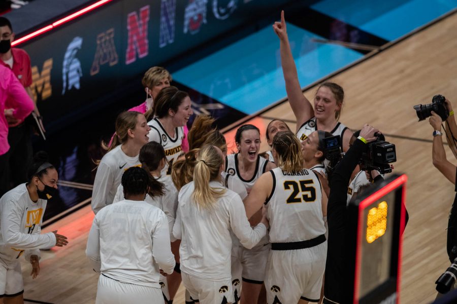 The+Iowa+Hawkeyes+celebrate+their+win+aganst+Michigan+State+after+the+semifinal+game+of+the+Big+Ten+women%E2%80%99s+basketball+tournament.+Iowa%2C+ranked+No.+6%2C+took+on+No.+7+seeded+Michigan+State+in+Indianapolis+at+the+Bankers+Life+Fieldhouse+Friday+afternoon.+The+Hawks+beat+the+Spartans%2C+87-72%2C+advancing+the+Hawks+to+take+on+Maryland+Saturday+in+the+Big+10+finals.