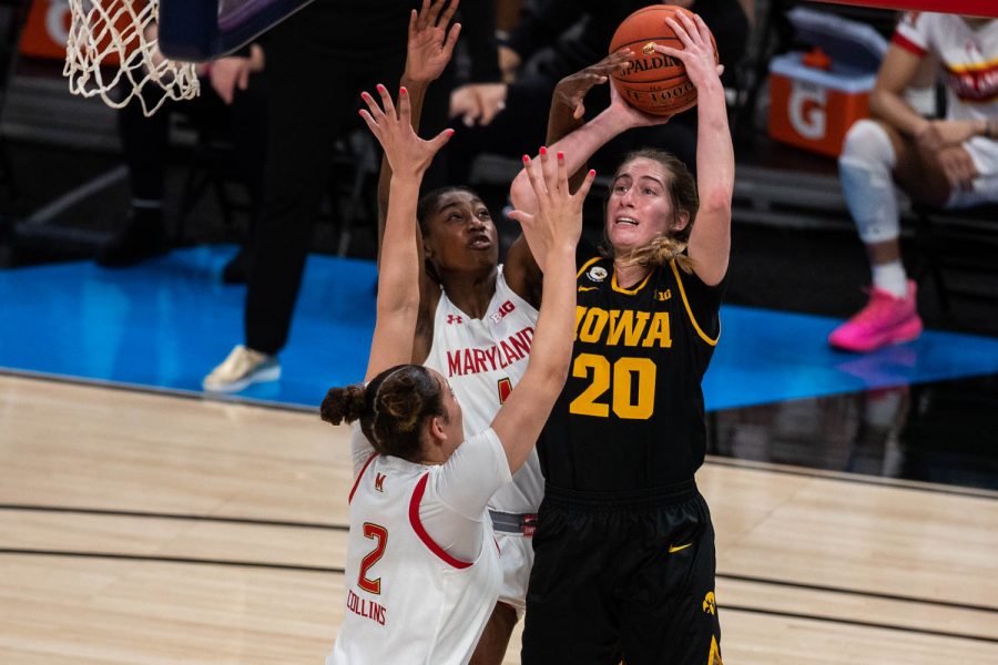 Iowa guard Kate Martin (20) goes up for a shot during the championship game of the Big Ten women’s basketball tournament. Iowa, ranked No. 6, took on No. 1 seeded Maryland in Indianapolis at the Bankers Life Fieldhouse Saturday afternoon. Maryland beat Iowa, 104-84, securing their spot as the 2021 Big Ten Champions. 