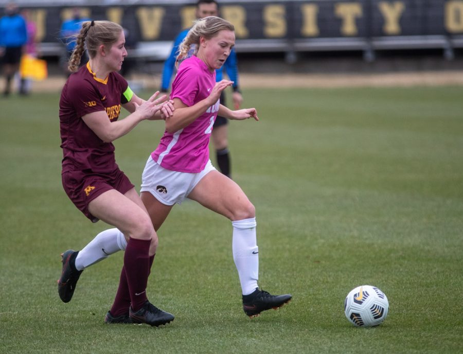 Iowa Midfielder Hailey Rydberg keeps the ball away from Minnesota’s defense during a soccer game between Iowa and Minnesota on March 14, 2021 at the Iowa Soccer Complex. The Gophers defeated the Hawkeyes 1-0. 