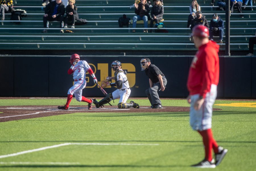 Iowa Catcher Austin Martin winds up to throw the ball around the field following a strike out of Nebraska Right Fielder Logan Foster during a baseball game between Iowa and Nebraska at Duane Banks Field on March 19, 2021. The Hawkeyes defeated the Cornhuskers 3-0.