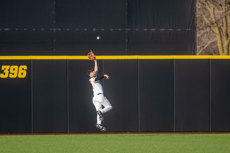 Iowa Center Fielder Ben Norman makes an over-the-shoulder catch to make the last out during a baseball game between Iowa and Nebraska at Duane Banks Field on March 19, 2021. The Hawkeyes defeated the Cornhuskers 3-0. 