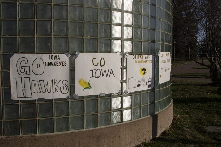 Signs+for+Iowa+men%E2%80%99s+gymnastics+hang+outside+the+west+entrance+of+Carver-Hawkeye+Arena+during+the+Iowa+v.+Nebraska+men%E2%80%99s+gymnastics+meet+in+Carver-Hawkeye+Arena+on+Saturday%2C+March+20%2C+2021.+Iowa+defeated+Nebraska+with+a+score+of+406.700+-+406.650.+This+was+the+Hawkeye%E2%80%99s+last+home+meet+of+their+final+season.