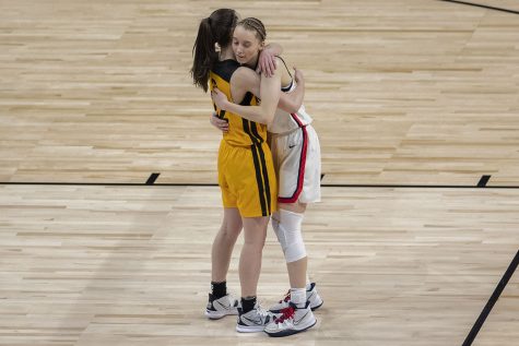 Iowa guard Caitlin Clark and UConn guard Paige Bueckers hug after the Sweet Sixteen NCAA womens basketball championship between Iowa and UConn on Saturday, March 27, 2021 at the Alamodome in San Antonio, Texas. The Hawkeyes were defeated by the Huskies, 92-72. Clark and Bueckers played together on the U-17 and U-19 Team USA basketball team in high school, and both say they are still close friends.