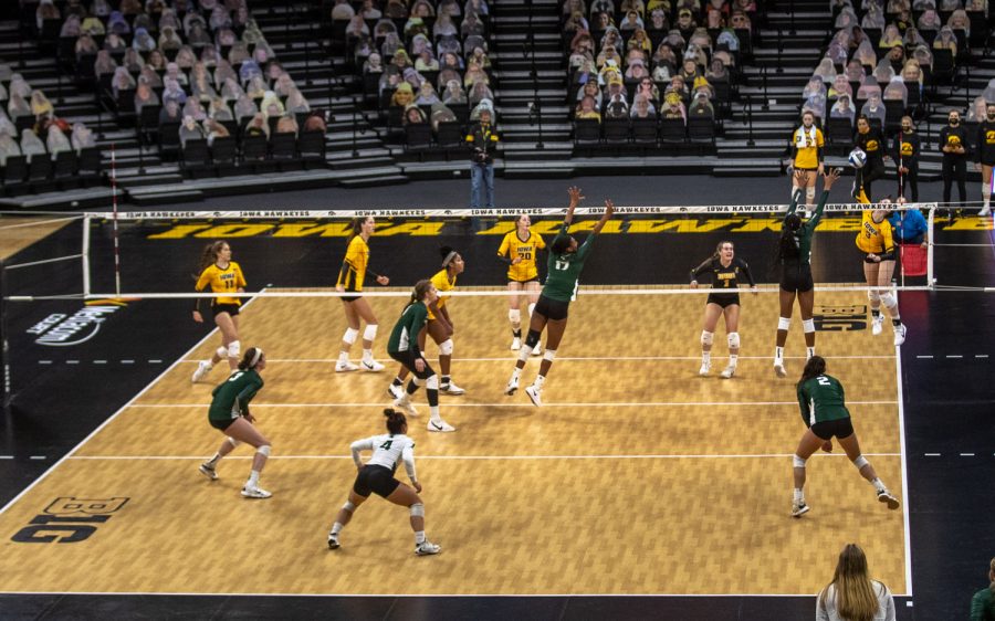 Iowa Outside Hitter Audrey Black hits a ball over the Michigan State defense during a volleyball match at Carver-Hawkeye Arena on Saturday, March 27, 2021. The Hawkeyes defeated the Spartans 3-0. 