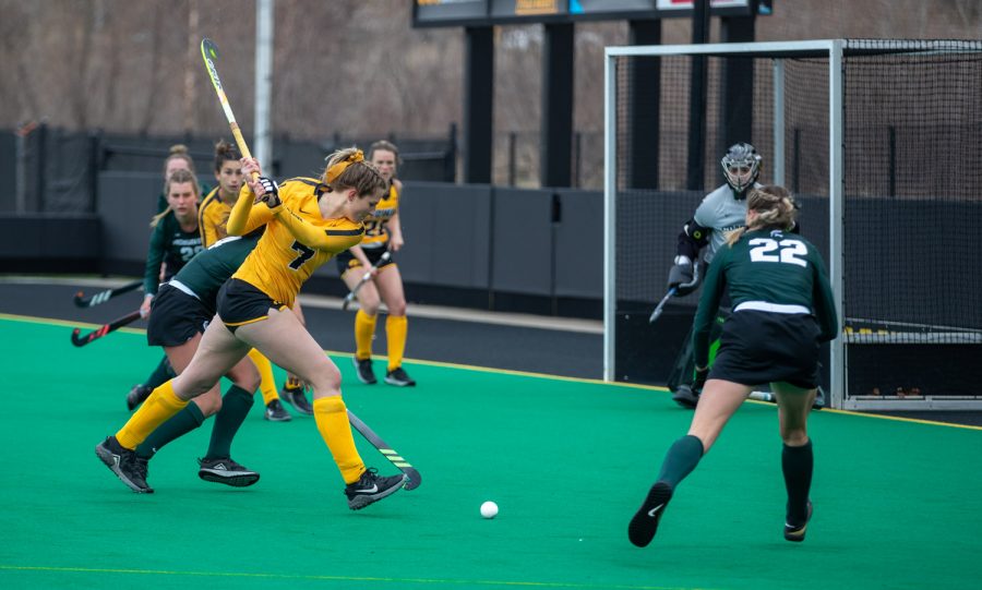 Iowa Midfielder Ellie Holley winds up to shoot during a field hockey game between Iowa and Michigan State at Grant Field on Friday, March 28, 2021. The Hawkeyes defeated the Spartans 2-0.
