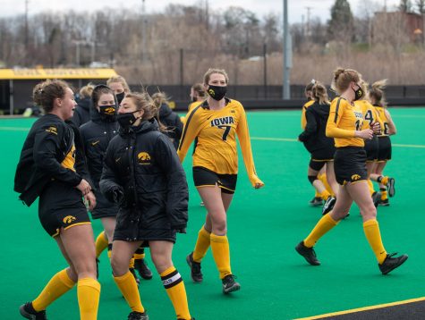 Iowa players celebrate and stretch during a field hockey game between Iowa and Michigan State at Grant Field on Friday, March 28, 2021. The Hawkeyes defeated the Spartans 2-0. 