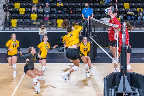 Iowa Outside Hitter Courtney Buzzerio hits the ball over the net during the Iowa Volleyball game against Indiana on Feb. 6, 2021 at Xtream Arena. Indiana defeated Iowa 3-2. 