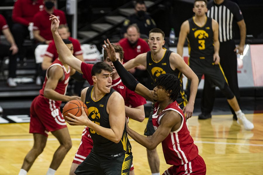 Iowa forward Luka Garza looks to pass during a menÕs basketball game between Iowa and Wisconsin at Carver-Hawkeye Arena on Sunday, March 7, 2021.