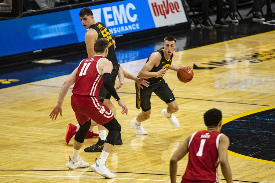 Iowa guard Joe Wieskamp dribbles during a menÕs basketball game between Iowa and Wisconsin at Carver-Hawkeye Arena on Sunday, March 7, 2021.