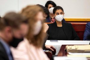 Des Moines Register reporter Andrea Sahouri listens to opening statements in her trial on Monday at the Drake University Legal Clinic in Iowa.