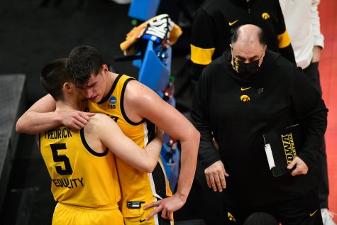 Iowa Hawkeyes center Luka Garza (55) hugs guard CJ Fredrick (5) after their 95-80 loss against the Oregon Ducks during the second round of the 2021 NCAA Tournament on Monday, March 22, 2021, at Bankers Life Fieldhouse in Indianapolis, Ind. Mandatory Credit: Sam Owens/IndyStar via USA TODAY Sports