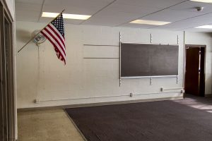The American flag is seen hanging in an abandoned room at Theodore Roosevelt Education Center seen on Monday, Feb. 22, 2021.