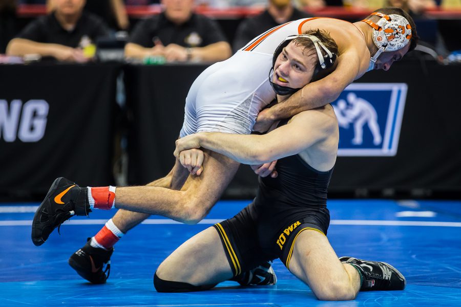 Iowa’s 125-pound Spencer Lee wrestles Oklahoma State’s Nicholas Piccininni during the fourth session of the 2019 NCAA D1 Wrestling Championships at PPG Paints Arena in Pittsburgh, PA on Friday, March 22, 2019. Lee won by decision, 11-4, and earned a spot in the finals of his weight class. 