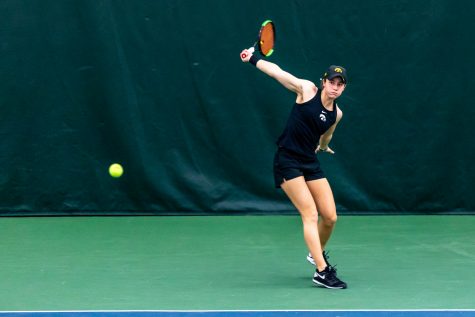 Iowa’s Elise van Heuvelen Treadwell sends the ball over the net during the Iowa Women’s Tennis match against Purdue on Feb. 28, 2021 at the Hawkeye Tennis and Recreation Complex. Iowa defeated Purdue 6-1.