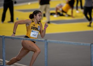Iowa’s Paige Magee runs the second leg of the Women’s 4x400-meter relay premier. The relay team finished 6th during the Hawkeye B1G Invitational track meet at the University of Iowa Recreation Building on Saturday, Feb. 13 , 2021. 