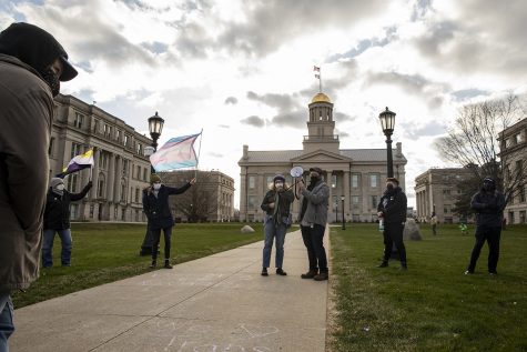 Community members speak during the Trans Day of Visibility rally at the Pentacrest on Wednesday, March 31, 2021. The event was put on by the LGBTQ Iowa Archives and Library, and featured chalking and speeches by members of the community.