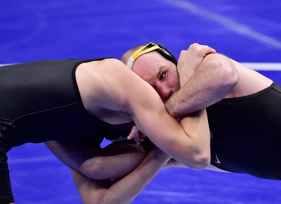 Mar 19, 2021; St. Louis, Missouri, USA;  Iowa Hawkeyes wrestler Alex Marinelli wrestles Stanford Cardinal wrestler Shane Griffith in the 165 weight class during the quarterfinals of the NCAA Division I Wrestling Championships at Enterprise Center. Mandatory Credit: Jeff Curry-USA TODAY Sports
