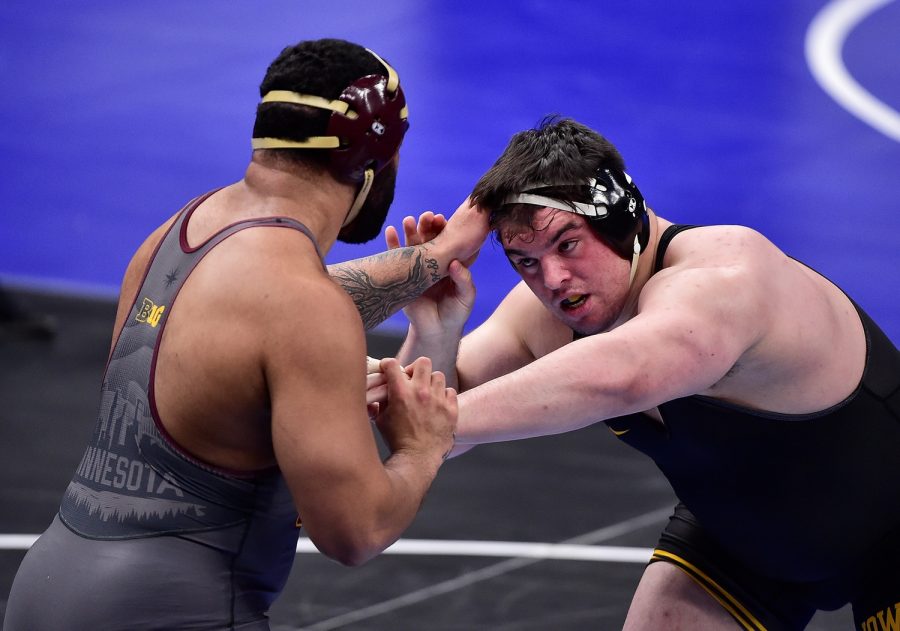 Mar 19, 2021; St. Louis, Missouri, USA; Minnesota Golden Gophers wrestler Gable Steveson wrestles Iowa Hawkeyes wrestler Tony Cassioppi in the 285 weight class during the semifinals of the NCAA Division I Wrestling Championships at Enterprise Center. Mandatory Credit: Jeff Curry-USA TODAY Sports