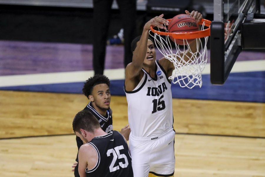 Mar 20, 2021; Indianapolis, IN, USA; Iowa Hawkeyes forward Keegan Murray (15) dunks the ball against the Grand Canyon Antelopes during the first round of the 2021 NCAA Tournament at Indiana Farmers Coliseum. Mandatory Credit: Katie Stratman-USA TODAY Sports