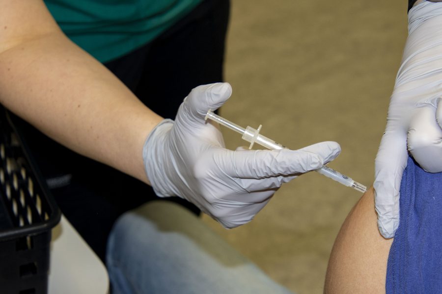 U of Iowa students given first round of vaccinations on Thursday, Jan 28, 2021. A medical student receives the Moderna vaccine.